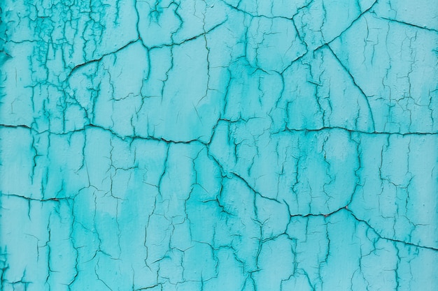 Natuurlijke abstracte achtergrond van geweven blauwe gebarsten muur.