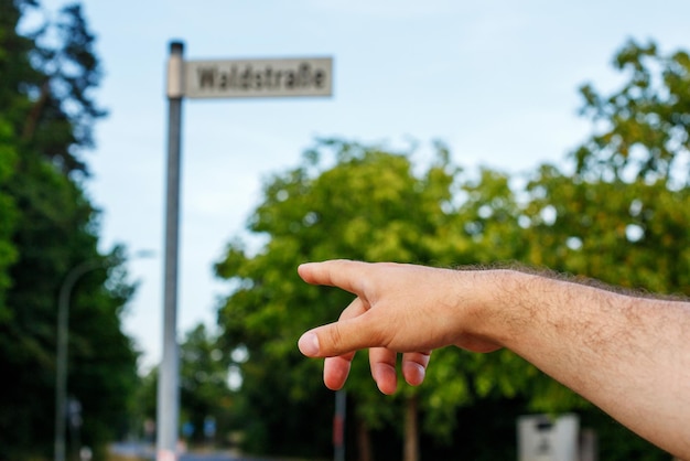 Navigating the Cityup of a Man Pointing to a Street Sign