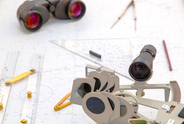 Navigation tools are on the navigation map Sextant plotter divider ruler and binoculars