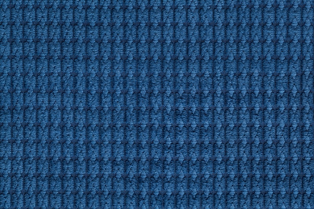 Navy blue soft fleecy fabric close up. 