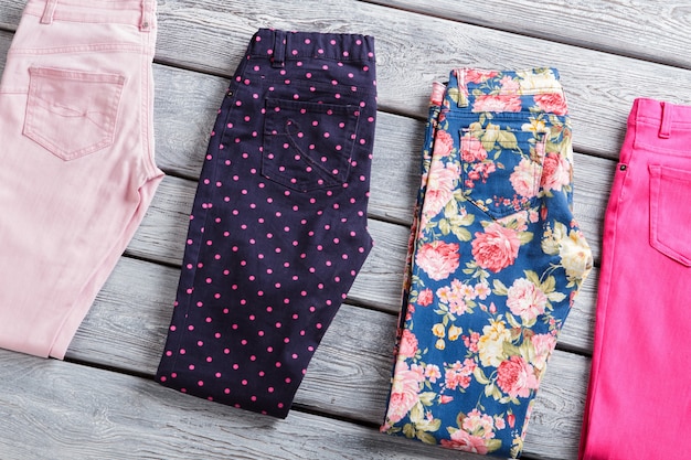 navy trousers with pink dots ladys blue and pink pants garments laying on gray table spring sale wit...