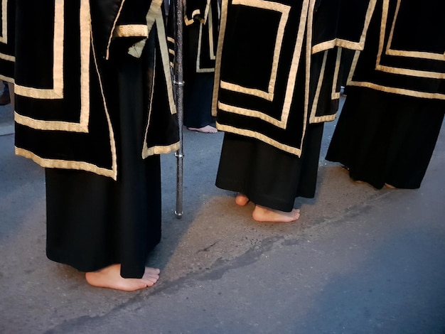 Nazarenes barefoot in penance in procession