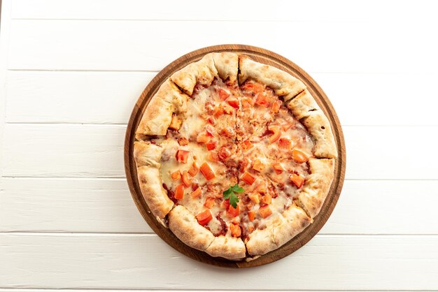 Neapalitan pizza with tomatoes on a white background top view