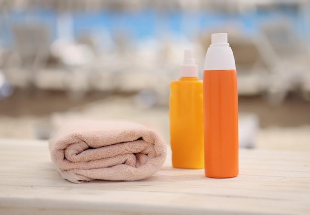 Necessary beach accessories sunscreen spray oil towel set of things for beach day