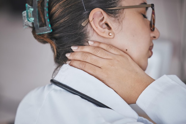 Neck pain doctor and hand of a healthcare worker with anxiety burnout and stress from work Wellness nurse and hospital employee joint injury at an insurance company feeling fatigue and tired