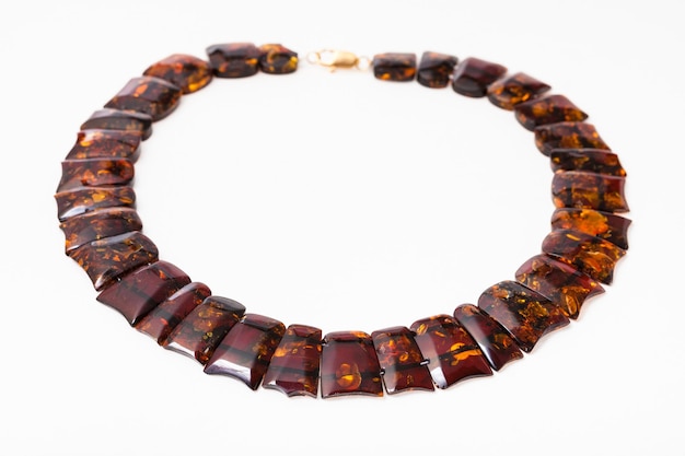 Necklace from polished faceted amber flat pieces