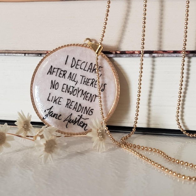 Photo necklace pendant with jane austen quote. i declare, after all, there is no enjoyment like reading.