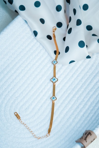 a necklace with a blue and white polka dot design.