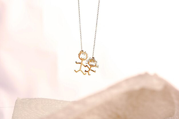 a necklace with a gold flower on it