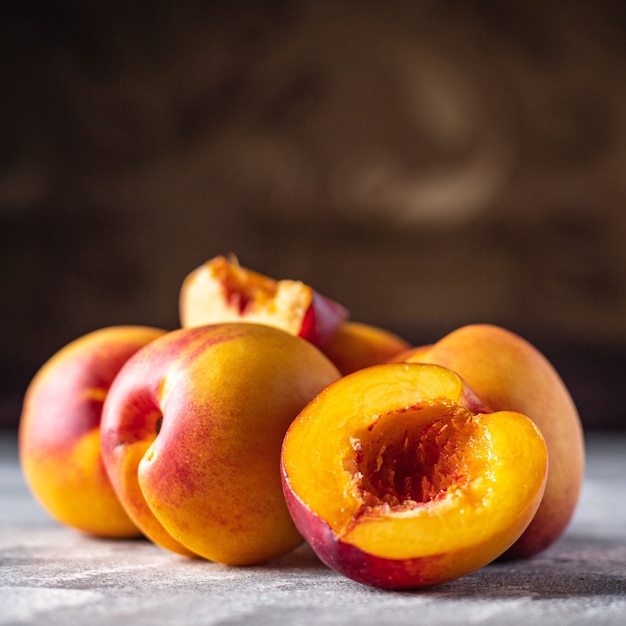 Nectarine fresh peach sweet fruit dessert sweets meal snack on the table copy space food background