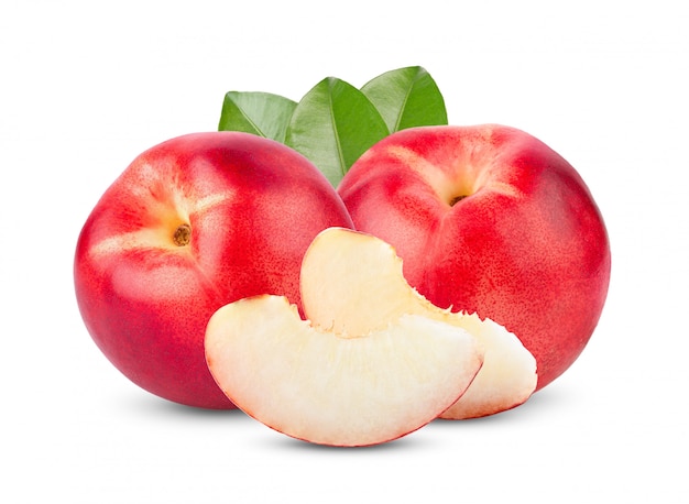 Nectarine fruit with leaves on white table. 