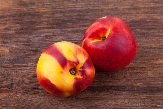 Nectarines on wooden table