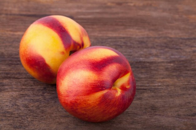 Nectarines on wooden table