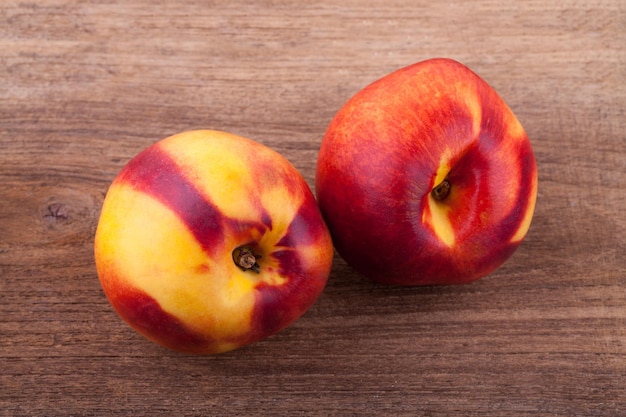 Nectarines on wooden tablexAxA