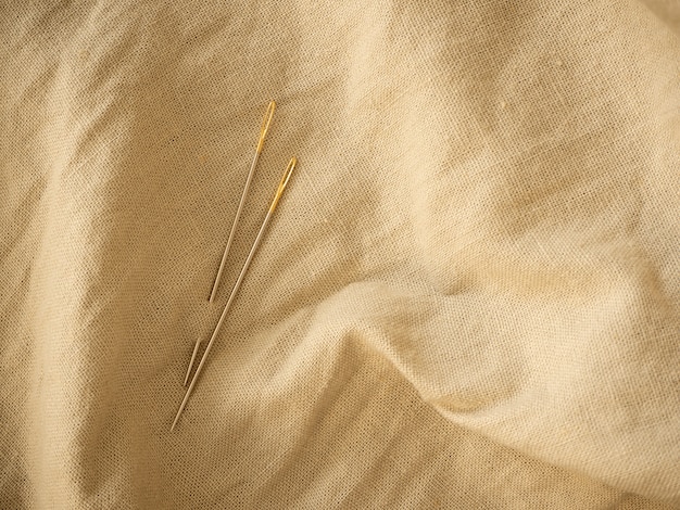 Needle and natural linen texture background