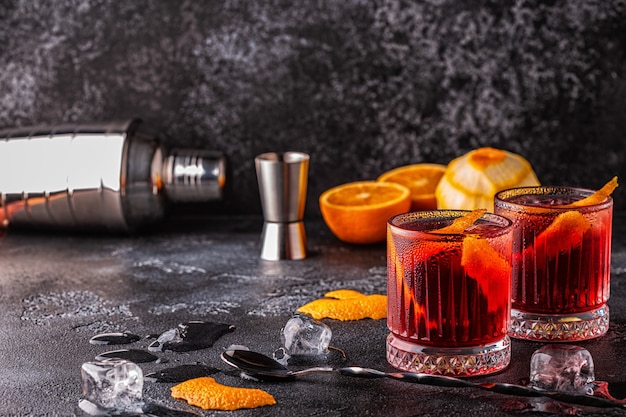 Negroni cocktail with orange peel and ice