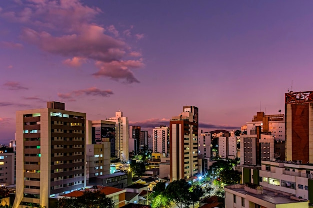 Neighborhood of the city of Belo Horizonte in Minas Gerais with its buildings lit up by the sunset