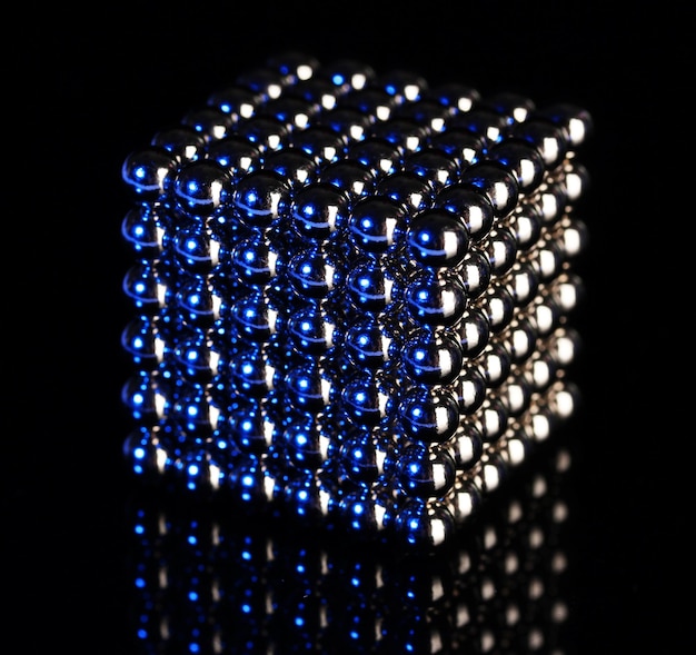 Neocube toy on black background