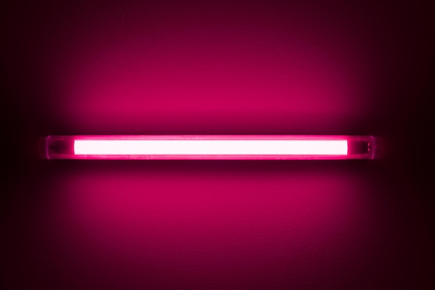 Neon elongated fluorescent lamp on the ceiling