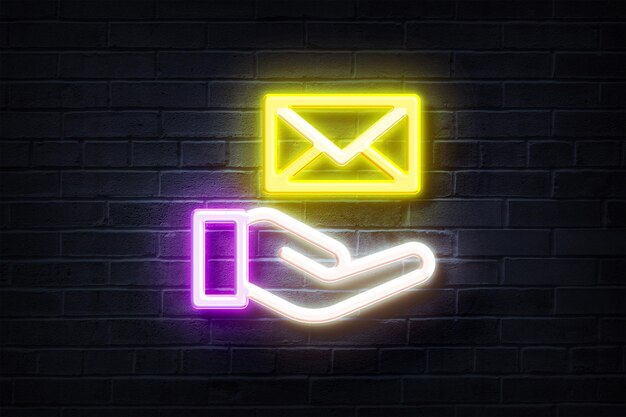 Neon hand and message on a brick wall