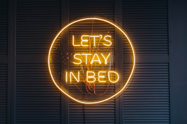 Neon inscription in the bedroom on the wall