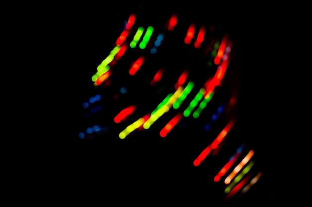 Foto neon kleurrijke gloed op een zwarte achtergrond iriserende neonachtergrond met lichteffect
