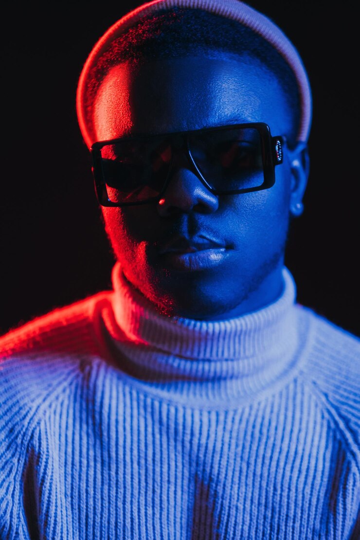 Neon light man night portrait handsome sunglasses