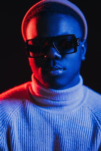 Neon light man night portrait handsome sunglasses