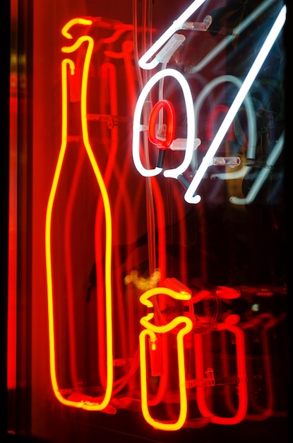 Neon logo of Chinese cafe, restaurant at building. illuminations, garlands. Urban