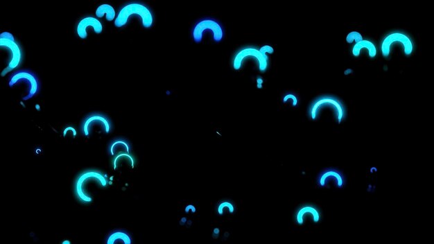 ネオンの輪が空間に動き振動するデザイン 小さなネオンの環が暗い空間に振動する 光の輪