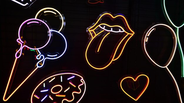 a neon sign in the window of a store called lips.