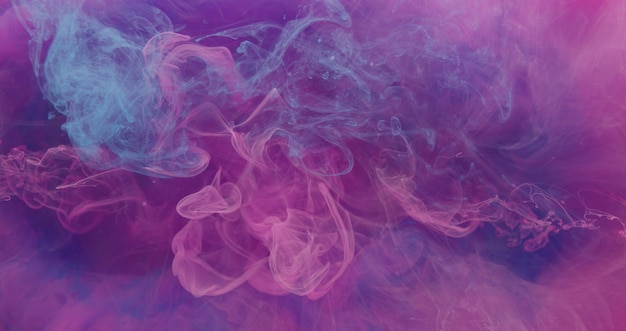 Neon smoke background ink in water pink blue vapor