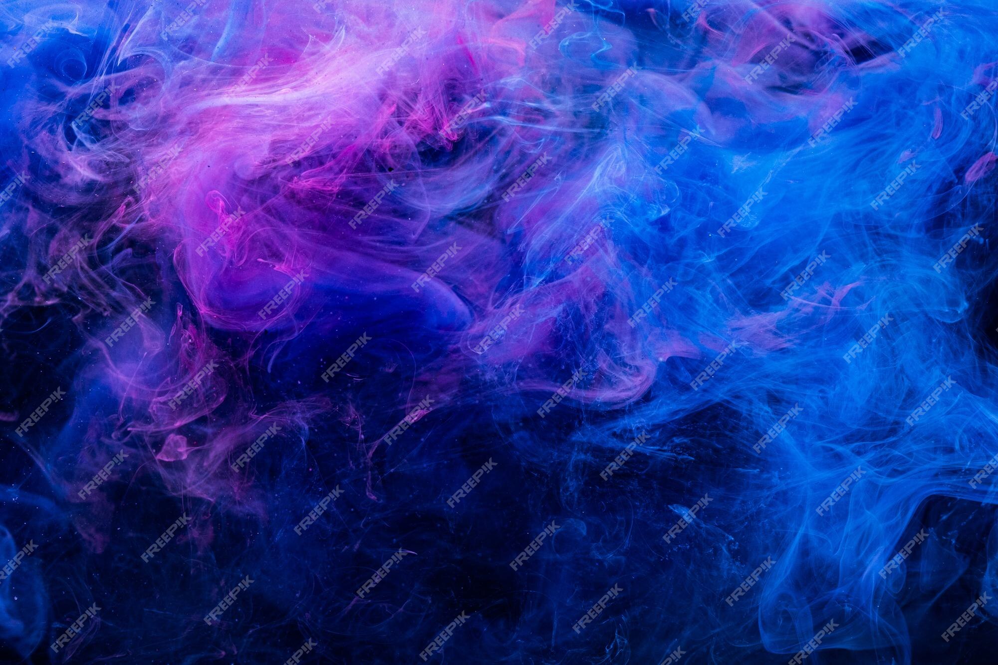 Premium Photo  Color in water. art background. fluorescent glowing steam  texture. bright ultraviolet blue purple glitter smoke cloud blend on dark.