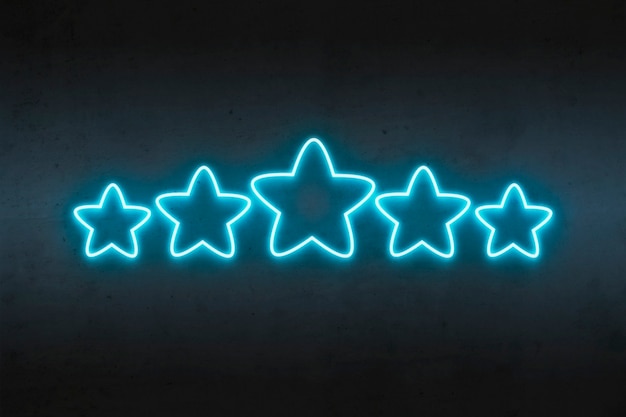 Neon stars rating blue on dark concrete.