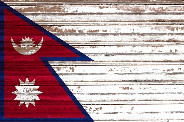 Nepal flag painted on a rustic old metal sheet