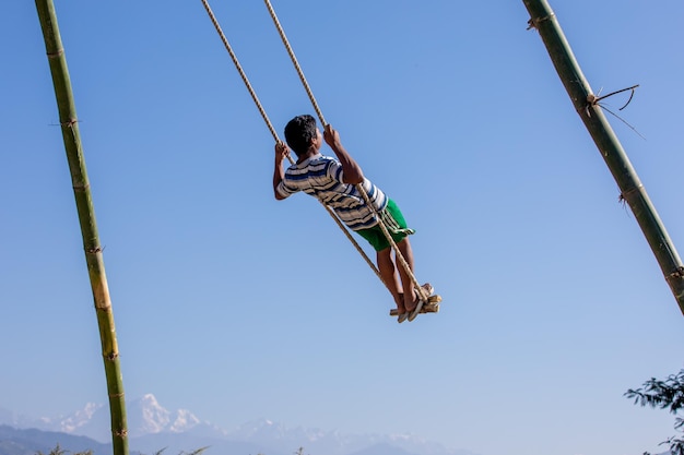 Nepalese people enjoy playing swing on the precious occasion of Dashain Festival Nepal