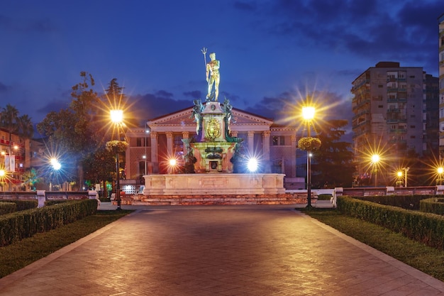 Neptune monument and ilya chavchavadze state drama theatre during blue hour in batumi adjara georgia