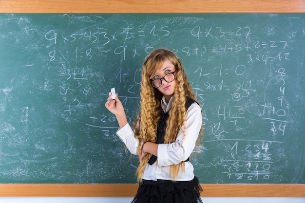 Nerd pupil blond girl in green board schoolgirl