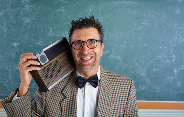 Photo nerd silly retro man with braces and vintage radio