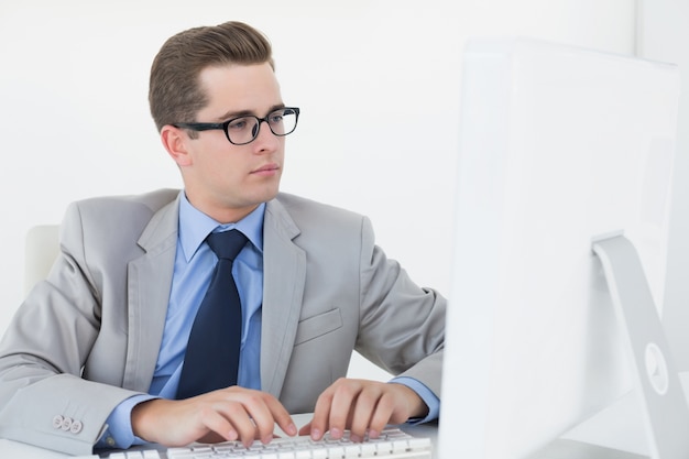 Nerdy businessman working on computer