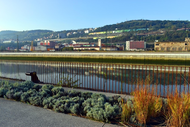 The Nervion estuary the Paseo de el Canal and the church of San Pablo Apostol in the Ribrea de Deusto Bilbao Basque Country