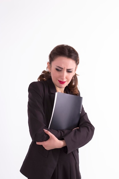 Nervous businesswoman with a folder of documents in her hands