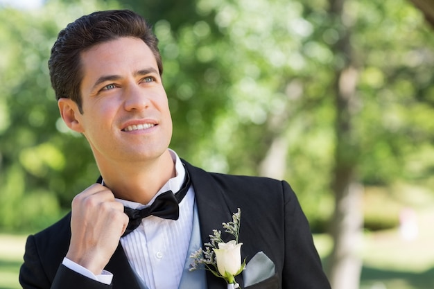 Nervous groom in garden