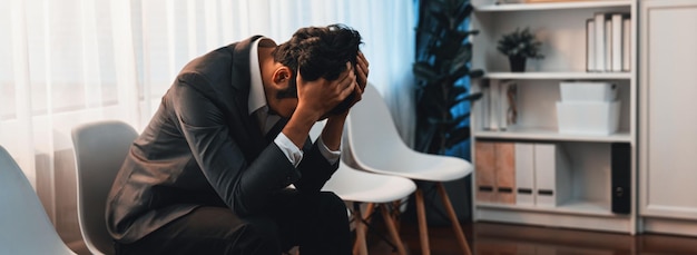 Nervous and panic job applicant with stressful emotion on job interview while he sitting and waiting for his turn Sad businessman holding his head with hands after making mistake Trailblazing