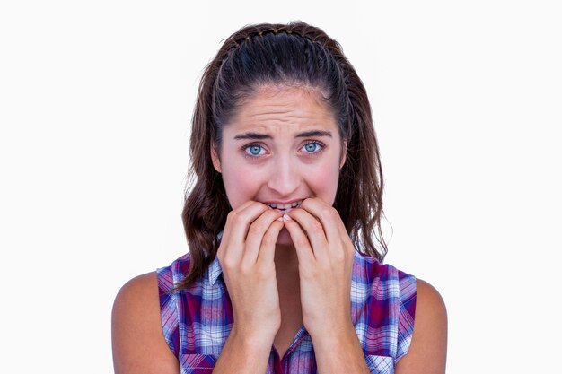 Photo nervous pretty brunette looking at camera