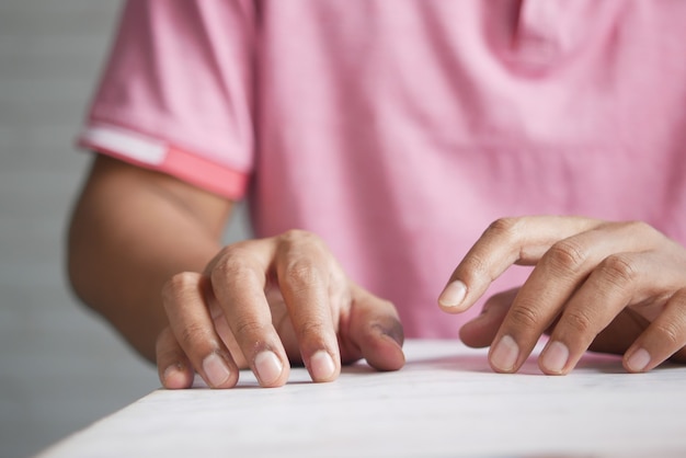 A nervous young man hand