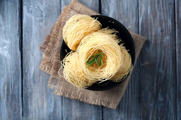 nest of pasta into a bowl