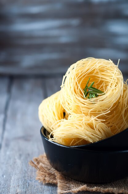 nest of pasta into a bowl