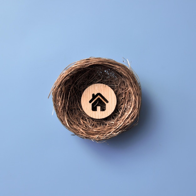 A nest with a house A symbol of the creation of a family and love of home