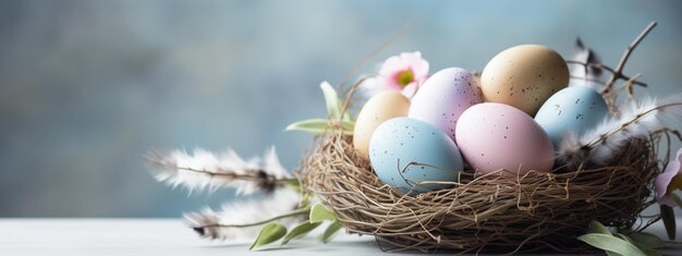 Nests with quail Easter eggs on a soft blue wooden background